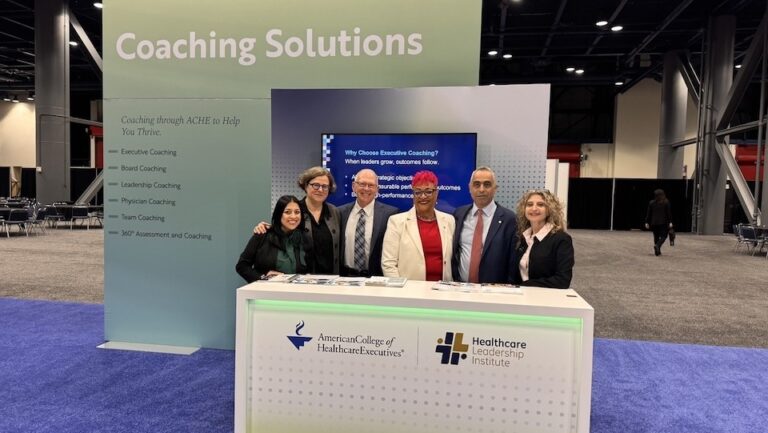 HLI team at ACHE with HLI logo web